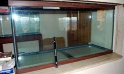 90 gallon aquarium is 48" W x 18"D x 25"H, glass and in good condition and has no leaks. ( foot ruler leaning on front of aquarium to see height.)
Oak stand very solid & built with 2x6's & 2x4's framing with a 3/4 " plywood top. Front, sides, and 2 doors