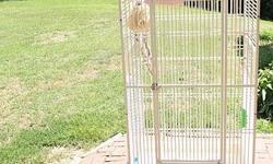 Large bird cage, white, strong, probably made of iron.
Great for medium to large bird.
62.5" tall.
24 " X 27 "
Rails are 3/4"or less apart, so might also work for smaller birds.
Not perfect, but In very good shape. Does not have original dishes or wheels
