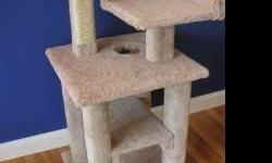Cat towers (also called cat condos, cat trees or cat gyms) are a specific type of cat furniture designed to stimulate your cat's natural playful tendencies of scratching, climbing and/or hiding.
Cat towers are a great way for active cats to play, exercise