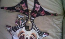 Brand new ORIGINAL Christian Audigier Bikini one piece swimwear , with the tags on it and christian audigier bag. Size Small , contact me for more info
(201)819-7931