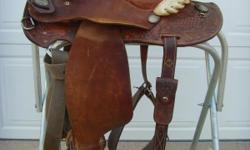 I have 5 saddles to sell and other tack. prices are 100.00 for the black older simco parade saddle , 100 for the old roping saddle, 150 for the youth barrel saddle fully tooled 15 inch seat, 225 for the big horn roping brown saddle on wooden saddle rack,