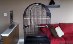 Almost new (3 months) large black bird cage. Ideal for cockatiel, parrot or other active bird.
Paid $175.00. Must sell. Several toys and amenities included.