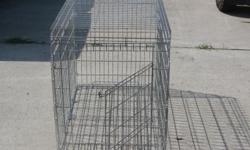 Large wire dog cage for sale. In good condition. Size: width-24", length-41", heighth-30". Selling due to getting rid of unused items around house.