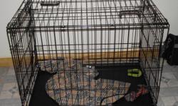 Medium size black metal dog cage with removable tray. Willing to meet whoever buys it depending on the location.